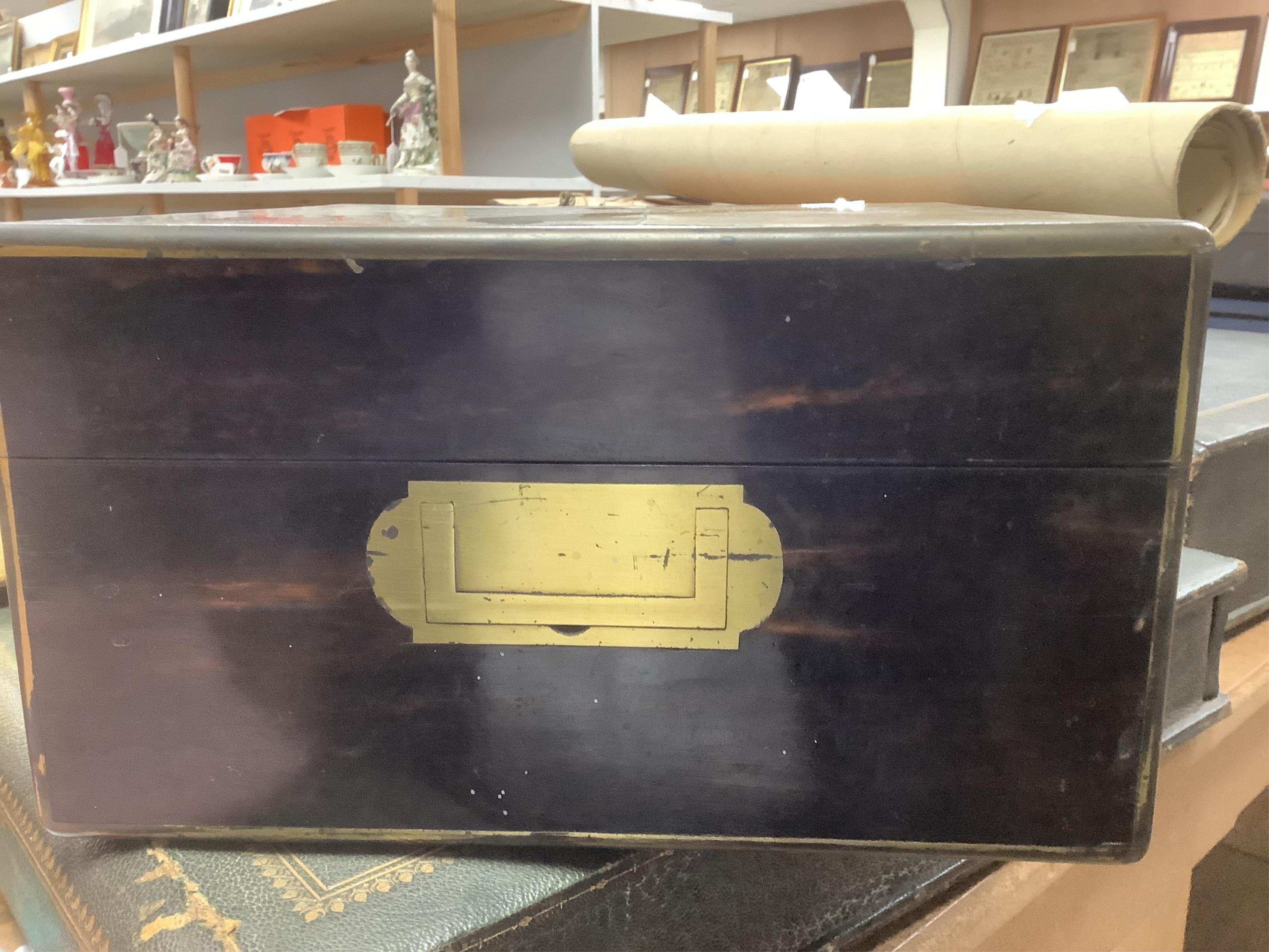 A Victorian brass mounted coromandel wood travelling toilet box, containing nine engine turned silver mounted cut glass toilet jars, with engraved initial, Brownett & Rose, London, 1870, the box of square form, with inse